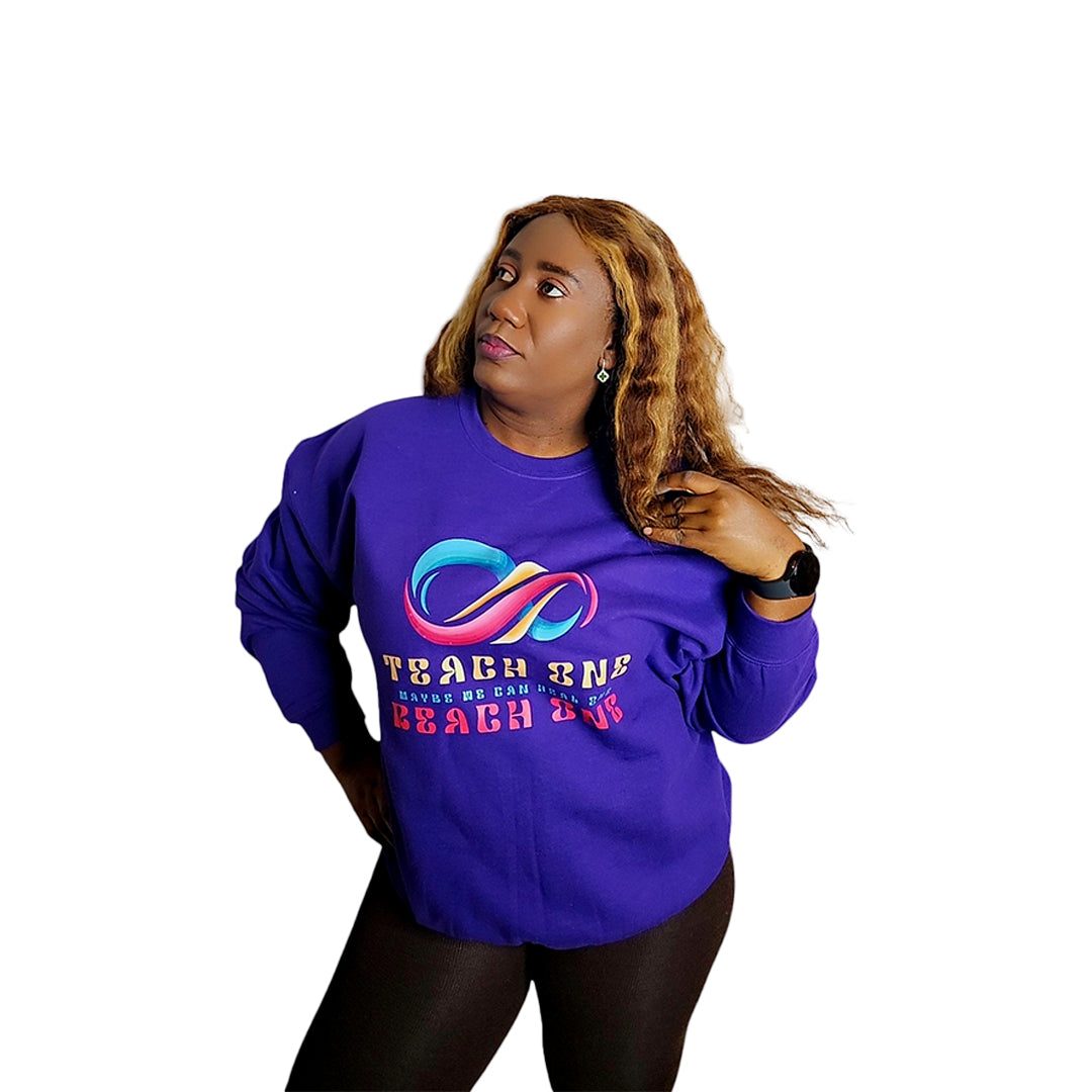 Comfy Unisex Crewneck in purple with colorful design, worn by model.