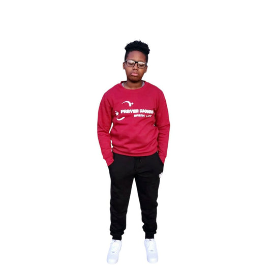 Prayer Works Speak Life Inspirational Crewneck in red worn by a person standing.