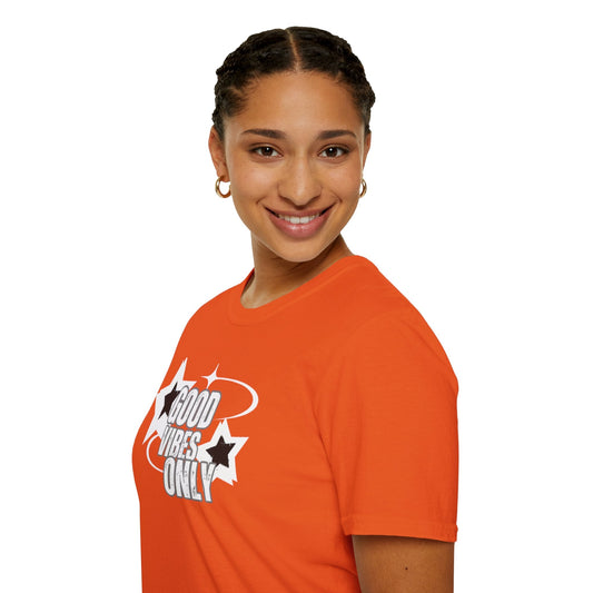 Bold female wearing "Good Vibes Only" T-shirt in orange, promoting positivity and comfort.