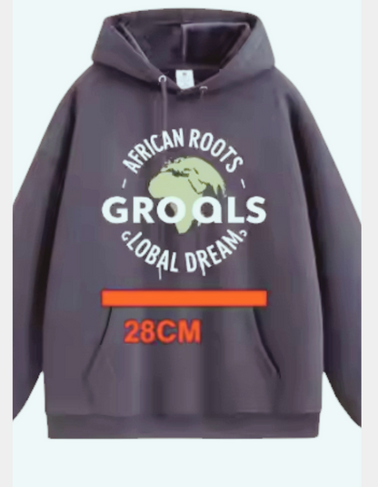 African Roots Global Dreams Hoodie with cultural design and slogan.